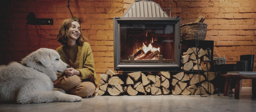 Girl sitting by Wood Stove